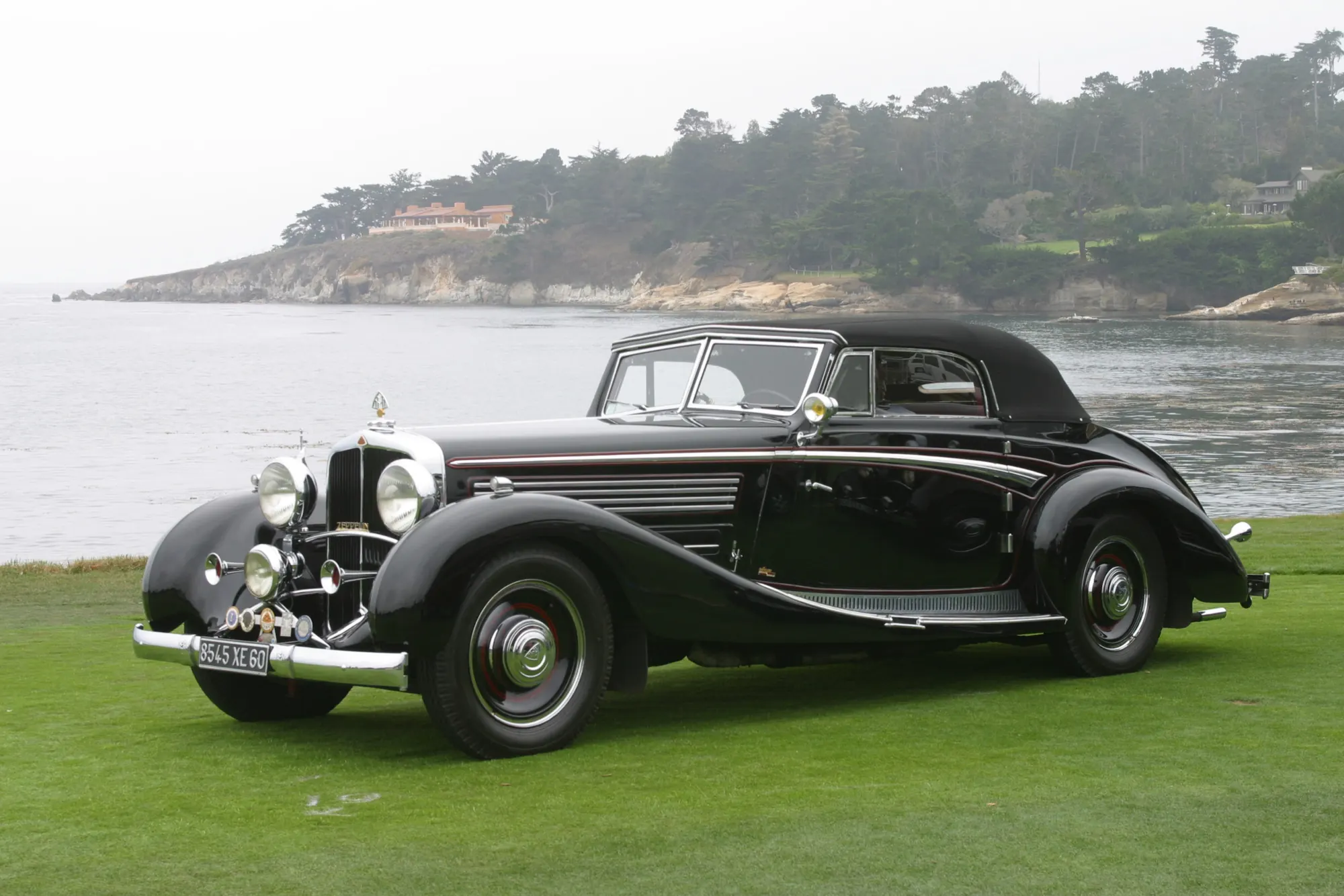 A classic Maybach on the lawn at Pebble Beach